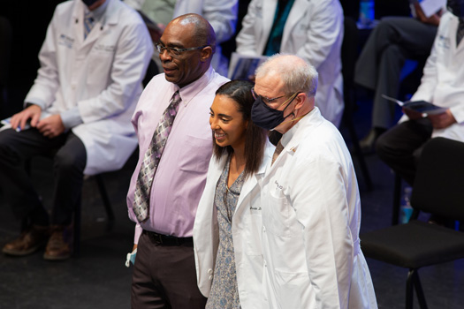 Second-year medical student Jordan Dudley receives her white coat.