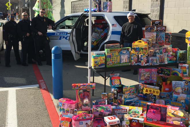UMMS police department members pictured at the Dec. 1 toy drive are (from left) Sgt. Nikkya Jackson, Officer Mariano Conte, Sgt. Christopher Alting and Officer David Cerreto.