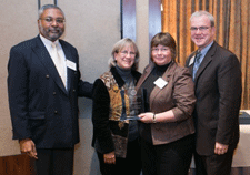 Carol Bova, PhD (second from right) accepts the Worcester District Medical Society President’s Award flanked by nominators Graduate School of Nursing Dean Paulette Seymour Route, PhD, and School of Medicine Dean Terence R. Flotte, MD, from awards chair George Abraham, MD, MPH.