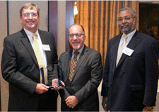 From left, Stephen Earls, MD, accepts the Worcester District Medical Society Career Achievement Award with nominator Dennis Dimitri, MD, from awards chair George Abraham, MD, MPH.