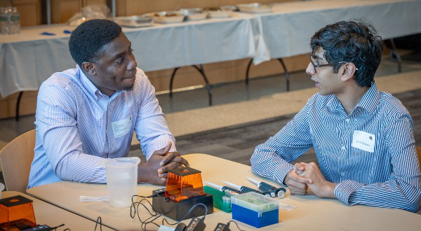 Photo of Shadrack Frempong of Boston working with a partner during the lab activity at “What the Heck is Biotech?”