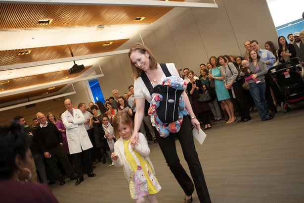 5-year-old Eloise and 5-month-old Lillian help mom Kristen Gerson get the envelope containing her ob/gyn match at Beth Israel Deaconess Medical Center.