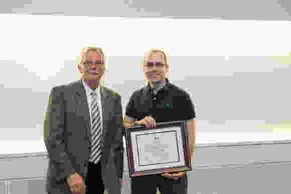 Dr. Carruthers and Faculty Award recipient Brendan Hilbert, PhD