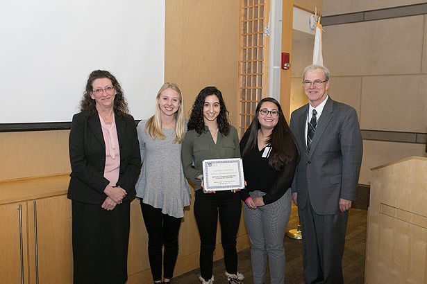 “STEM Start: Engaging Worcester middle school girls in science and technology” MLK Semester of Service Award winners stand with Dr. Haley and Dean Flotte.
