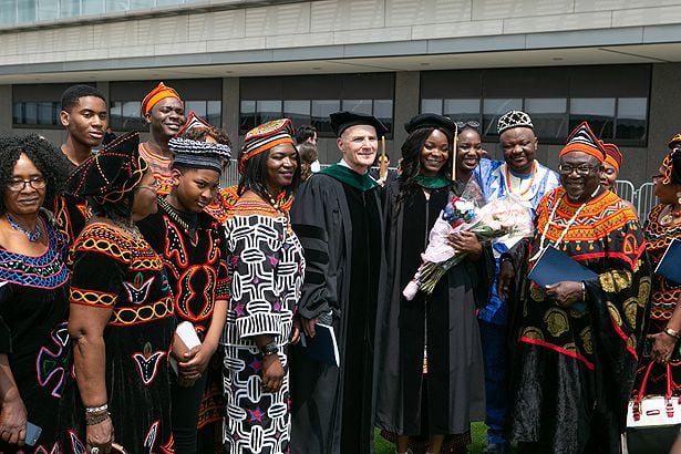 Nguendab Gwanyalla, MD, center, with house mentor Michael Ennis, MD, and her family