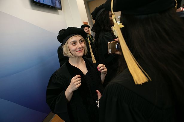 Gabrielle Steinberg readies for her graduation from the School of Medicine.
