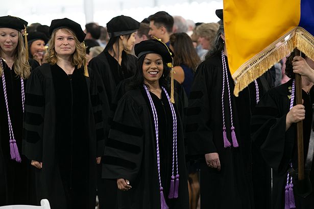 Samia Ahmed and members of the Graduate School of Nursing Class of 2019 process into the ceremony tent.