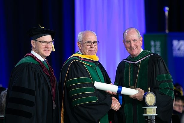 Dean Flotte, Dr. Kirch and Chancellor Collins pause after Kirch is awarded an honorary degree.