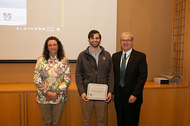 (from left) Dr. Haley, MLK Semester of Service Award winner John Romano, SOM ’22, and Dean Flotte