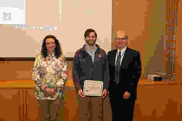 (from left) Dr. Haley, MLK Semester of Service Award winner John Romano, SOM ’22, and Dean Flotte