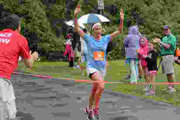 Jackie Slocombe, 36, of Somerville, is the first woman to finish the race.