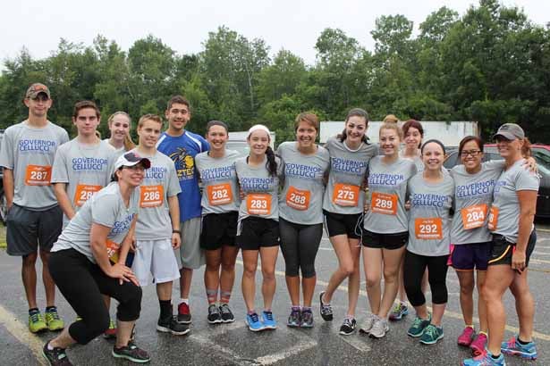 The track & field squads from Assabet Valley Regional Technical High School gather together before running the Governor Cellucci Tribute Road Race in Hudson.