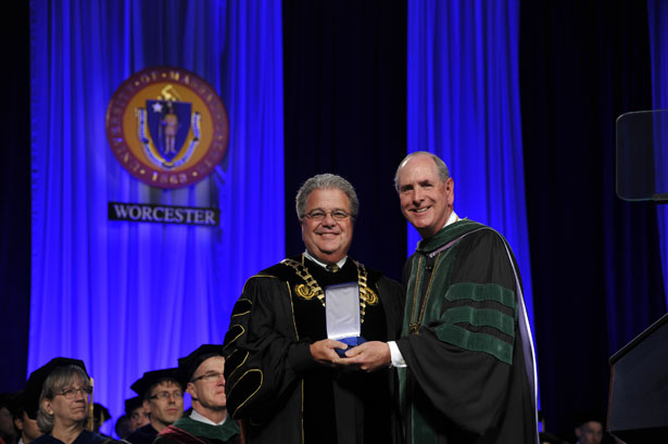 Chancellor Collins presents President Robert Caret with the Chancellor’s Medal.