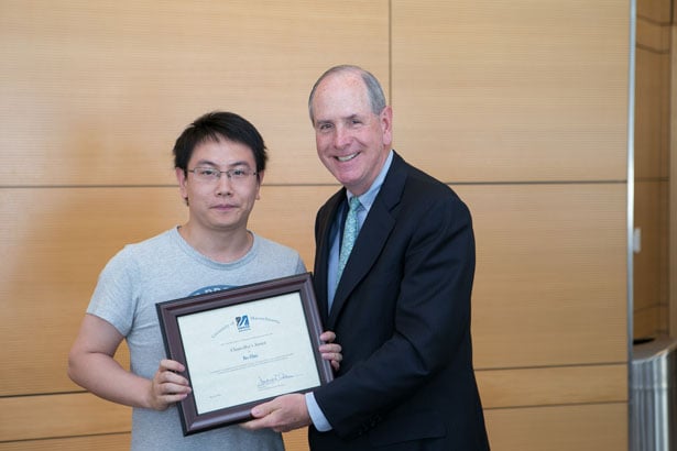 Chancellor Collins presented GSBS student Bo Han with the Chancellor’s Award
