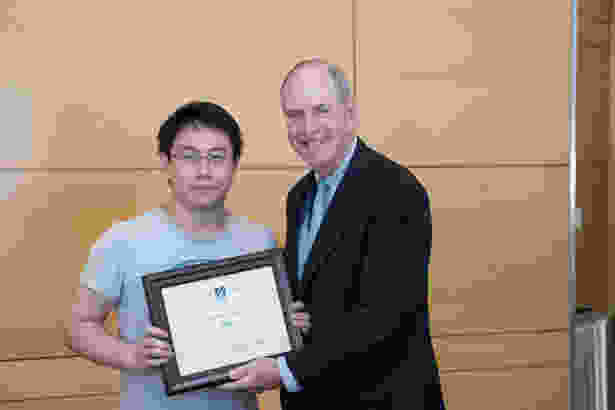 Chancellor Collins presented GSBS student Bo Han with the Chancellor’s Award