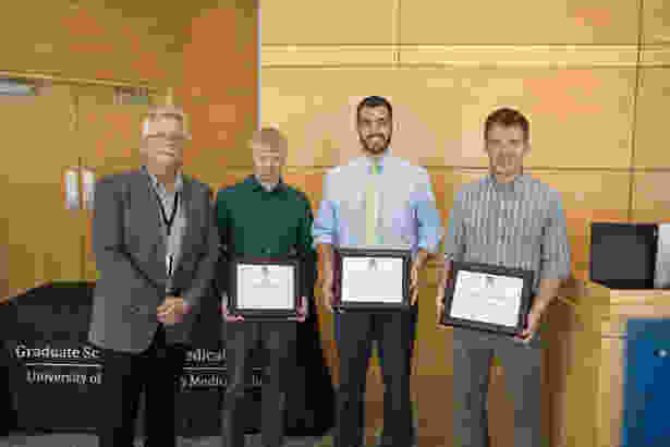 Dean Carruthers, with Curriculum Achievement Award recipients (L-R) Nicholas Rice, Michael Kiritsy and Jacob Hunnicutt.
