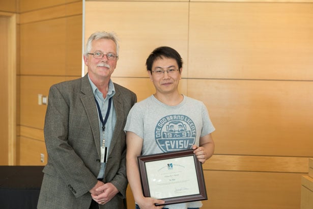 Dean Carruthers with Chancellor’s Award recipient Bo Han