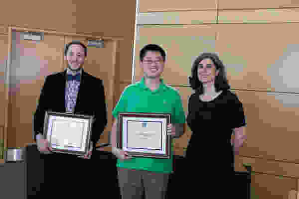From left, Noah Silverstein and Jiayi Fan accept Curriculum Achievement Awards from Associate Dean Mary Ellen Lane.