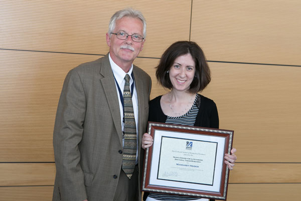 Margaret Heider is given the Dean’s Award for Outstanding Thesis Research from Dean Carruthers.