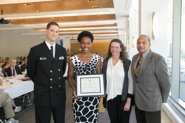 Jessica Long, (center), accepts the Excellence in Public Health Award from Lt. Commander Andrew Geller, MD, Heather-Lyn Haley, PhD, and Robert Layne, MEd.