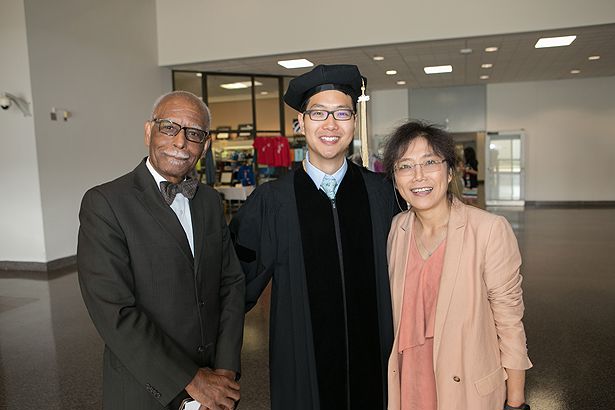 SOM graduate Yevin Roh with family friend Winston Langley and mother Eunsook Hyun