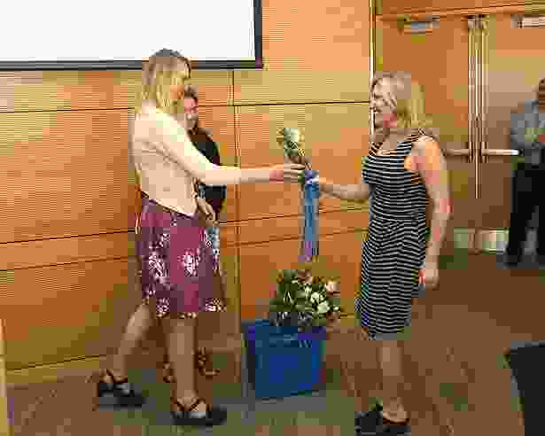 The ceremony closes with each graduate receiving a rose from members of the GSN Graduate Student Nursing Organization.
