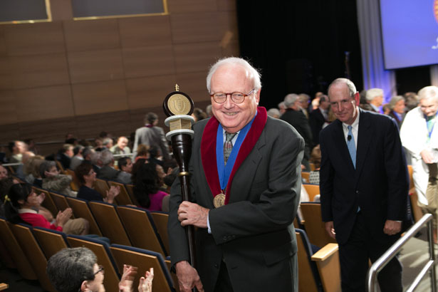 Chancellor’s Medalist Thoru Pederson, PhD, leads the recessional at Convocation, carrying the ceremonial mace.