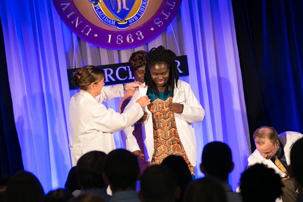 Marian Younge dons her first white coat.