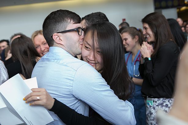 Michael Buckner and Emily Fan embrace upon learning where they matched.