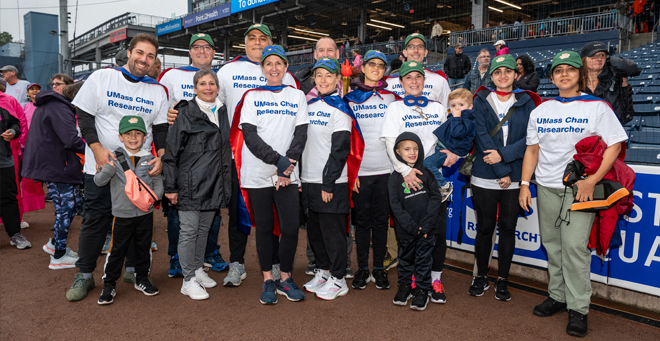 UMass Cancer Walk co-founder Dottie Manning joins UMass Chan researchers for a photo.