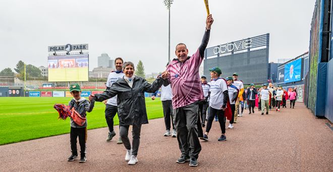 Dottie Manning, co-founder of the UMass Cancer Walk, leads the survivor lap.