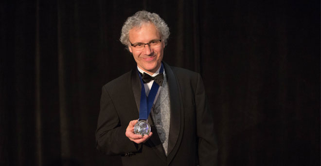 BALTIMORE, MAY 2, 2016 -- Victor R. Ambros, PhD, holds the silver medal in the design of the Roosevelt dime presented to him at a black tie dinner and ceremony as  co-recipient of the 2016 March of Dimes and Richard B. Johnston, Jr., MD Prize in Developmental Biology. His co-recipient was Gary Ruvkun, PhD, of the Massachusetts General Hospital and Harvard University. Photo by Jason Turner