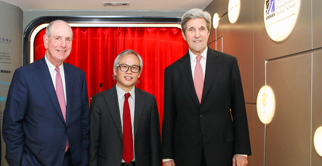 Chancellor Michael F. Collins with Li Weibo and John Kerry at the 2018 Shenzhen Life and Health Sciences Conference in Shenzhen, China.