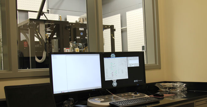 The Talos-Arctica cryo-electron microscope, pictured here through the window of the control room, is one of two state-of-the-art systems housed in the new Massachusetts Facility for High Resolution Cryo Electron Microscopy at UMass Medical School.
