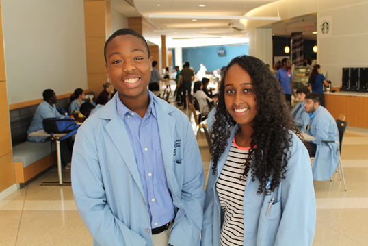 Oris Amegbe (left) and Mureena Issa are among the 20 local teens taking part in the High School Health Careers summer program at UMMS.