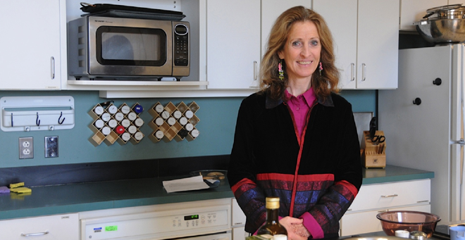 IBD anti-inflammatory diet creator and clinical trial co-investigator Barbara Olendzki is pictured in the kitchen where she holds cooking classes for participants. 