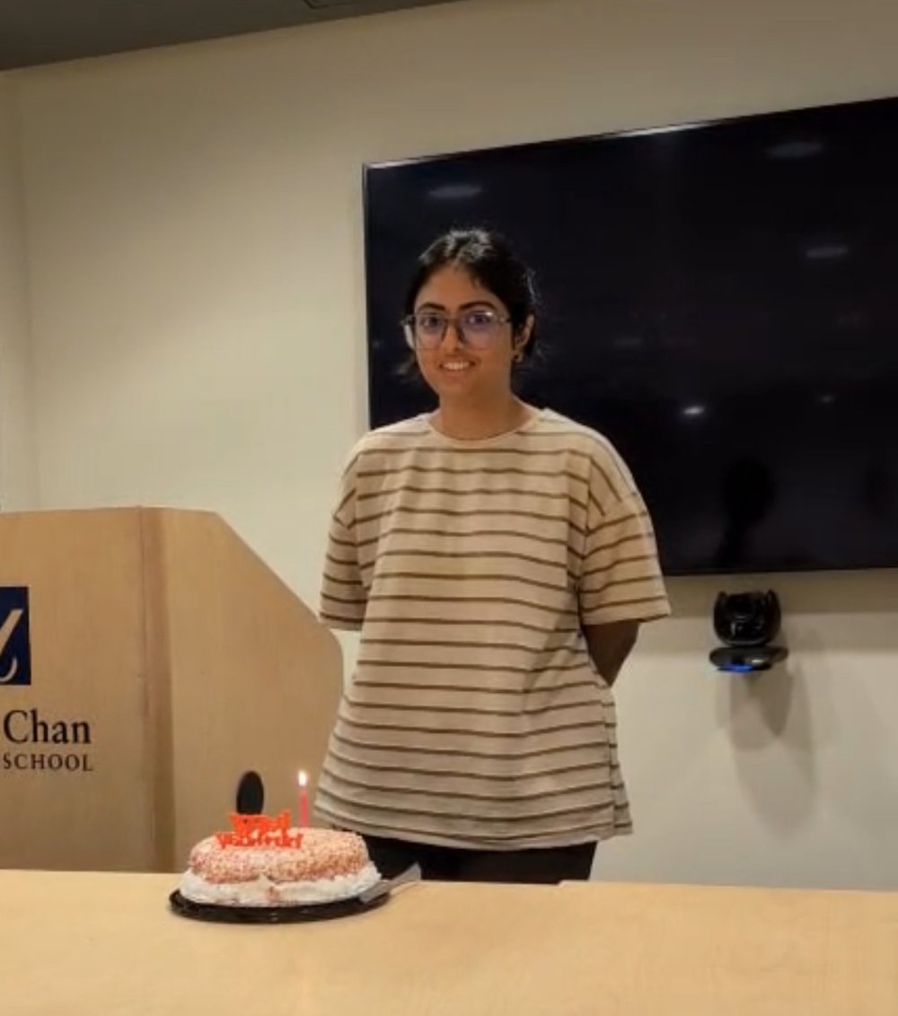 Prasanthi Kaja smiling behind her birthday cake
