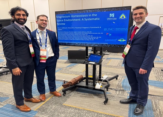 Three Primary Care residents at a digital poster session