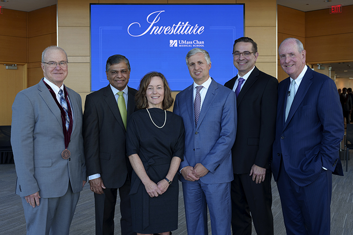 Dean Terence R. Flotte; newly invested faculty members Vaikom S. Mahadevan, MD, Sharon B. Cantor, PhD, Andres Schanzer, MD, and Michael A. Brehm, PhD; and Chancellor Michael F. Collins.  