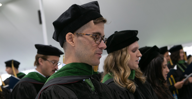 Sean Boyden and classmates read the oath